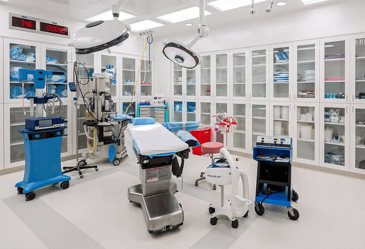 Empty clinical interior at 4208 Richmond with surgical equipment, cabinetry, and overhead lights, with no people or records visible.